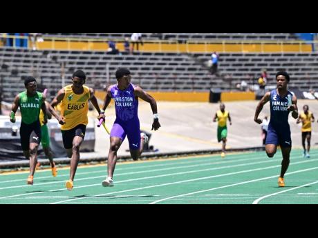 Kingston College (third left) win the boys’ 4x100m relay ahead of Excelsior High at the inaugural Grand Slam Track meet held at the National Stadium.