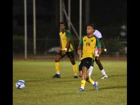 Credit: Ashley Anguin Jamaica's Sue-Lae McCalla makes a pass during an international friendly against Trinidad and Tobago at the Montego Bay Sports Complex on February 6.