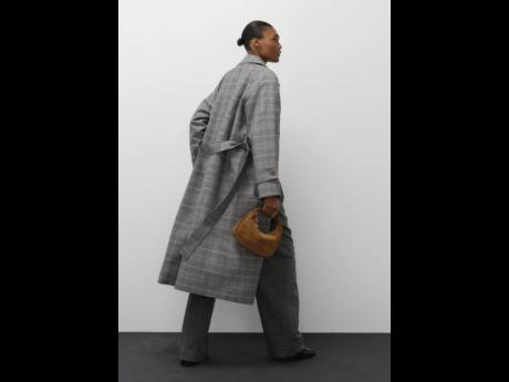 Lensed by Victoria Zschommler last month, the Jamaican beauty is currently in Australia. In this shot, Depass is in the new Oroton checkcoat, with the Clara suede minibag, in hand.
