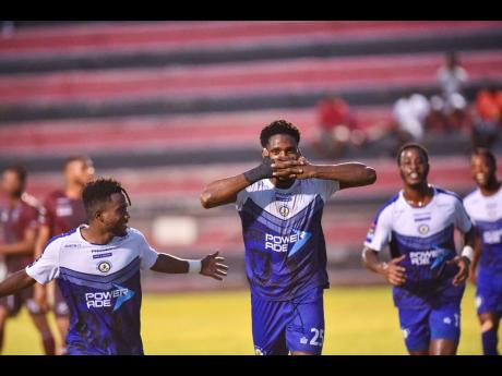 Mount Pleasant’s Raheem Edwards (centre) celebrates a goal against Chapelton Maroons during their Jamaica Premier League game at the Anthony Spaulding Sports Complex yesterday. Mount Pleasant won the game 2-0.