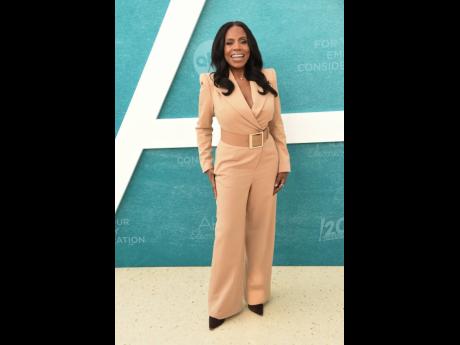 Left: Ralph brought her signature elegance and warmth, dressed by daughter Ivy Coco Maurice, in a camel jumpsuit by Sergio Hudson Collections. 
