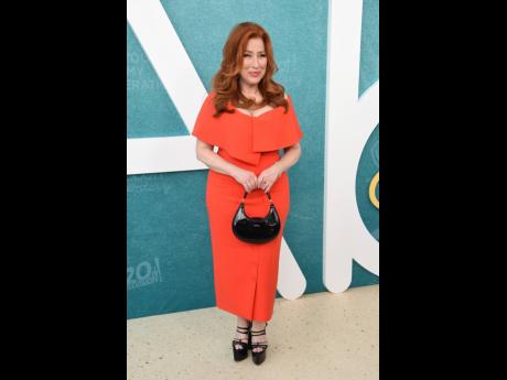 Lisa Ann Walter walked the carpet in a vibrant orange off-the-shoulder midi. 