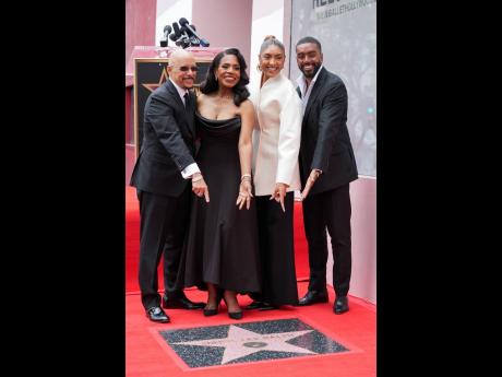 Veteran actress Sheryl Lee Ralph (second left) is flanked by her loving family during the ceremony commemorating her star on the Hollywood Walk of Fame on Wednesday in Los Angeles. She is joined by (from left) husband Vincent Hughes; daughter Ivy Coco Maur