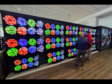 Credit: Nam Y. Huh Customers shop for televisions at a retail store in the USA, Thursday, April 3, 2025.