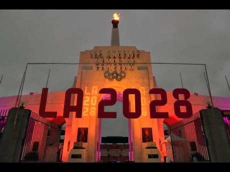 A LA 2028 sign is seen in front of the Olympic cauldron at the Los Angeles Memorial Coliseum on Wednesday, September 13, 2017.