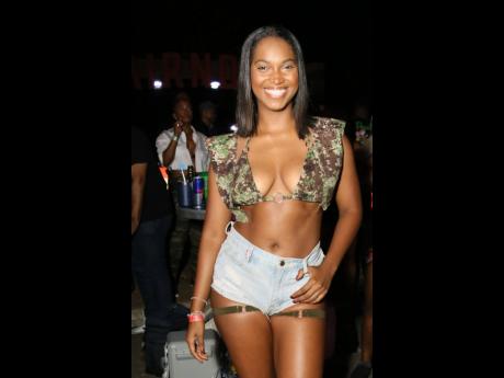 Credit: Nathaniel Stewart Coming in hot, television host Mandy Cowan rocks a camo halter and vest by Kitty Dzzignz, paired with denim shorts.