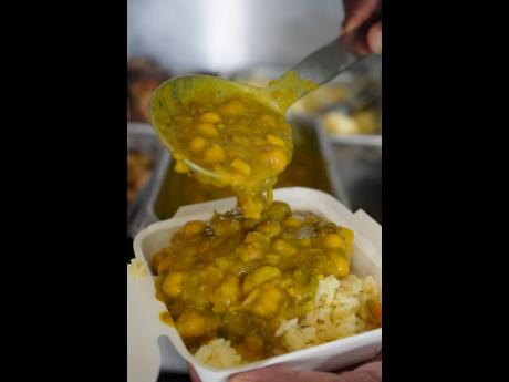 Credit: Dandre McKenzie Curry chickpeas with lentils atop callaoo rice.