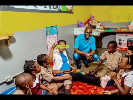 Students at Seaview Gardens Primary engage in tailored reading exercises inside the Literacy Room, a key feature of the D&G Foundation’s Literacy Programme out of the ‘No Mind Left Behind’ initiative. Observing the session is Foundation Accountant, D