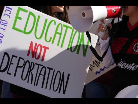 Students march at Arizona State University in protest of ASU's chapter of College Republicans United-led event encouraging students to report "their criminal classmates to ICE for deportations", January 31, 2025, in Tempe, Arizona. (AP Photo/Ross D. Frankl