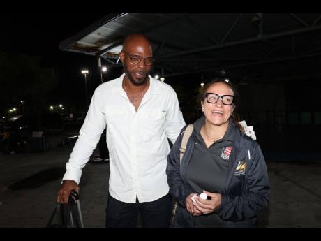 
Stephen Jones, president of Jamaica Boxing Association, greets Elise Seignolle, president of the Pan American Boxing Confederation, at the Norman Manley International Airport yesterday.