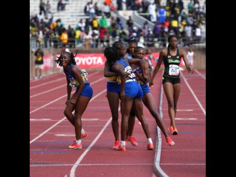 Hydel High School’s athletes celebrate winning the final event of the Penn Relays, the Championships of America 4x400-metre relays inside Franklin Field Philadelphia, Pennsylvania, yesterday.