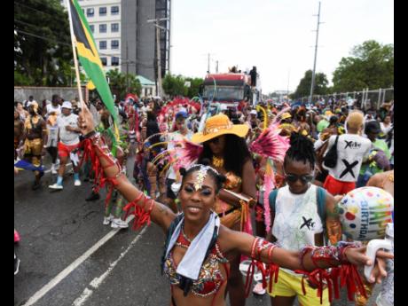 Credit: Ricardo Makyn Xodus revellers make their up Hope Road in St Andrew. Xodus revellers make their up Hope Road in St Andrew.