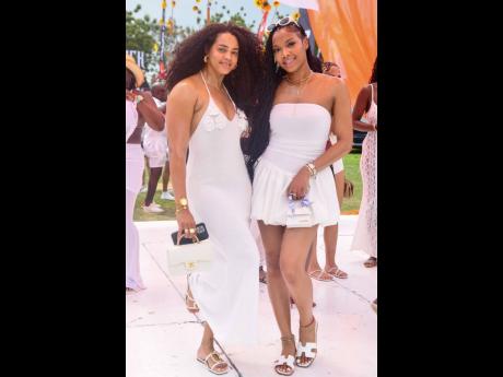 Estrella Marie (left), fitness coach, and her friend, Tassaun Morris, are both glowing in white.