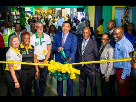 Prime Minister Dr Andrew Holness cuts the ribbon to officially open Expo Jamaica 2025 on April 3..
