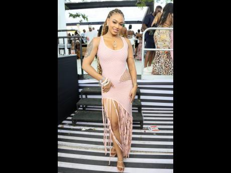 Achsah Henry celebrates the spring season in this baby pink fringe dress custom-made from Trinidad.