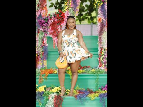 Ronece Simpson, attorney-at-law, channels playful charm in a fruity-print mini.