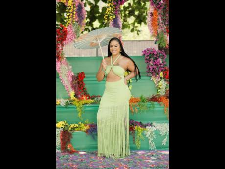 Health administrator Camille Nichole owns the garden runway in a fresh green maxi, adorned with fringe details.