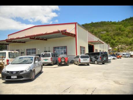 This photo shows the Chinese car servicing garage, WH Car Service in Ferry, St Catherine 