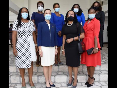 In this 2020 photo Jamaica Labour Party (JLP) and Peoples National Party (PNP) female senators pose for a photo. They are, from left, Natalie Campbell-Rodriques, Janice Allen, Kamina Johnson-Smith, Sherene Golding-Campbell,Donna Scott-Mottley, Sophia Frase