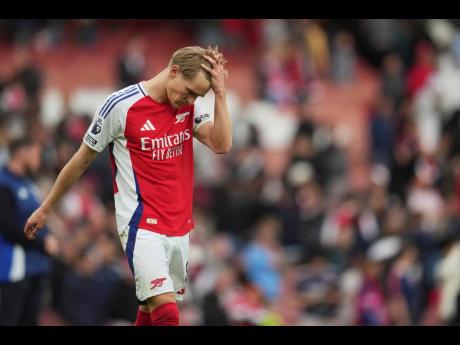 AP 
Arsenal’s Martin Odegaard leaves the field at the end of the English Premier League against Bournemouth at Emirates in London yesterday.