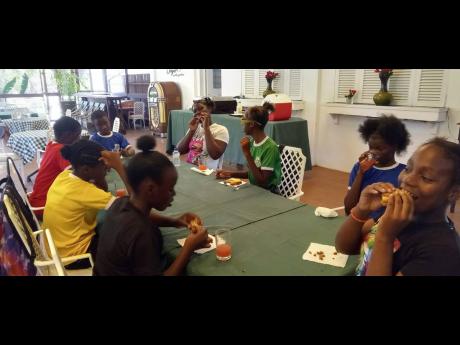 Students of Holy Trinity Grade 7 Academy enjoy some downtime at a recently organised outing to Hope Gardens. 
