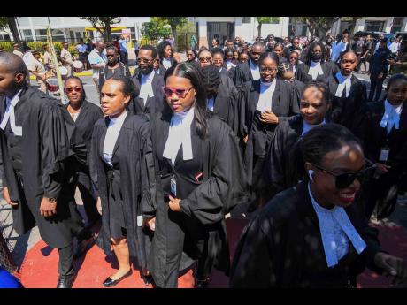 Credit: Antoine Lodge Members of the Judiciary marching along King Street in downtown Kingston in celebration of International Judiciary Day at the Inaugural Judiciary Day held on May 7 at Justice Square on King Street.