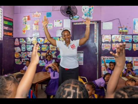 Credit: Contributed D&G Foundation Administrator Totlyn Brown-Robb engages students at Christian Early Childhood Academy ahead of their interactive Read Across Jamaica Day storytelling session with foundation volunteers.