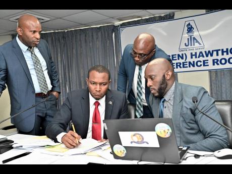 Credit: Rudolph Brown
Dr Mark Smith, (second left) with (from left) Dr. Mark Nicely, Leighton Johnson, and Mark Malabver, at the JTA Special Press Conference on the JTC Bill.