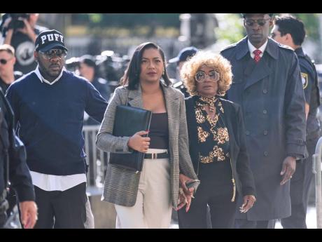 Janice Combs, mother of Sean 'Diddy' Combs, second from right, arrives to the courthouse in New York, Monday, May 12.