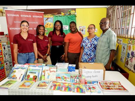 Sygnus made an official handover of essential supplies to Riverton Meadows Early Childhood Centre. Pictured (from left) are Sygnus’ Nichole Lobban, VP Wealth Management and client strategy; Shané Sicard, senior manager, tax and accounting; Soshakay Palm