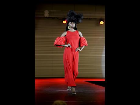 Esther Moore, one of 30 contestants in the 2025 Miss Universe Jamaica competition, models a striking Women of  Virtue hat and Heather Laine.