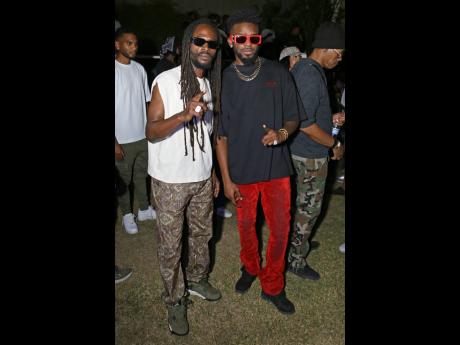 Entertainers Jesse Royal (left) and Kemar Highcon show their support for Aidonia as he marked his 20th anniversary in the music business.