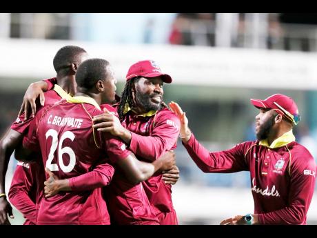  West Indies players celebrate beating England by 26 runs in a One Day International match at Kensington Oval in Barbados in 2019.