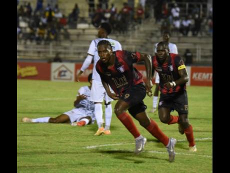 
Arnett Gardens’ Warner Brown celebrates scoring the equaliser against Cavalier during their Jamaica Premier League first-leg semi-final football game at the Catherine Hall Sports Complex in Montego Bay on Thursday.
