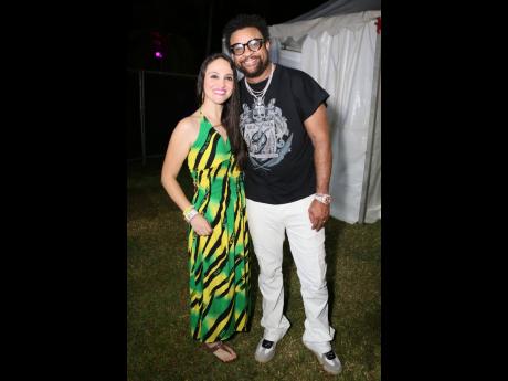 Reggae and dancehall superstar Orville ‘Shaggy’ Burrell (right) poses with Magnolia Vanegas, Pepsi Cola Jamaica’s field marketing manager, who showed her island pride in a Jamaican flag-coloured maxi. 