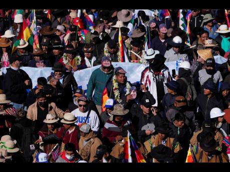 Supporters of former President Evo Morales march towards the offices of the Electoral Tribunal in El Alto, Bolivia, Friday, May 16.