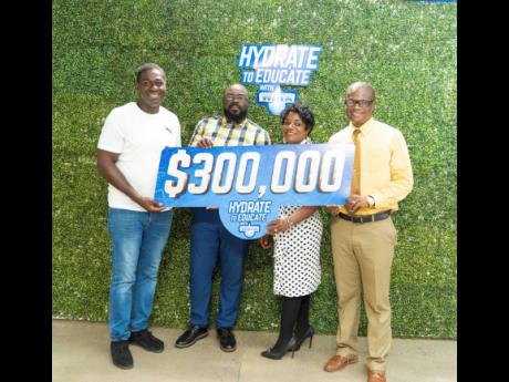 Representatives of Paul Bogle High School, Donald Quarrie High School, and May Day High School proudly pose with a Hydrate to Educate symbolic cheque during the 2023 handover ceremony for the initiative powered by WATA. The schools were among the top award