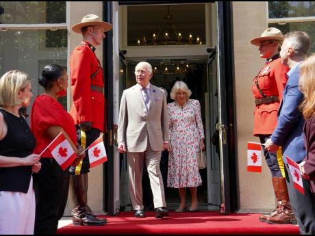 Britain’s King Charles (centre left) and Queen Camilla leave after visiting the Canada House Trafalgar Square, in London, Tuesday, May 20, 2025, to mark 100 years since it opened in June 1925. 