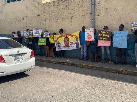 
People calling for justice in the Mario Deane case during a protest at the Barnett Street Police Station in Montego Bay, St James, on Independence Day in 2019.