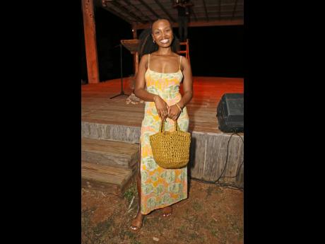 London author of ‘For Such a Time as This’, Shani Akilah, delivers effortless charm in a citrus-hued floral ASOS dress, paired with a woven straw bag and minimalist sandals.