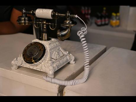 Guests skipped the traditional book and left messages on a 19th-century-style rotary phone, creating a memorable audio keepsake.