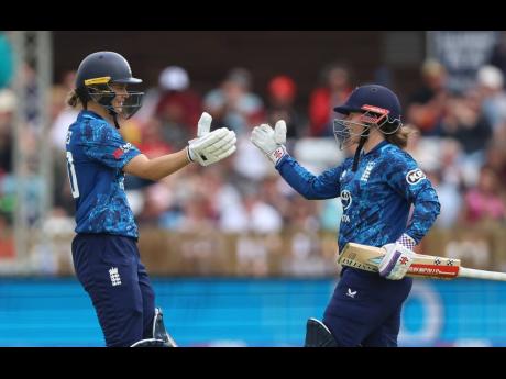 England Women’s Amy Jones (left) and Tammy Beaumont scored their second consecutive centuries against the West Indies Women yesterday.