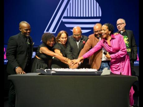 Celebrating 70 years of showcasing Jamaica as a destination, the Jamaica Tourist Board (JTB) team had lots to celebrate at the Hard Rock Hotel in Manhattan, New York, on Wednesday. Cutting the 70th anniversary cake with Minister of Tourism Edmund Bartlett 