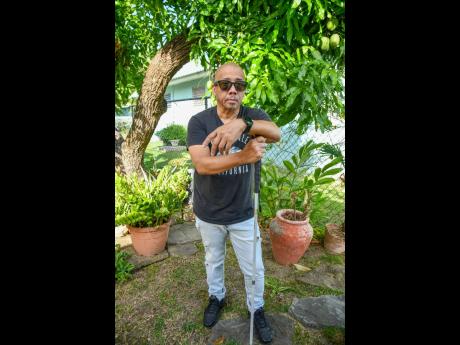 Credit: Matthew McKoy The co-founder of internationally acclaimed sound system Black Chiney is photographed in the garden at his home in Mona, St Andrew.