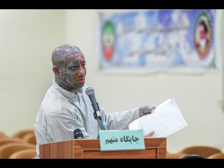 Credit: AP Iranian rapper Amir Hossein Maghsoudloo, also known as Tataloo, speaks during his trial at the Revolutionary Court in Tehran, Iran.