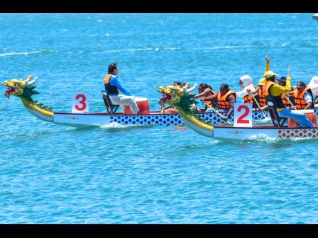 Participants go head to head during an event at the inaugural Dragon Boat Festival at the Grand Excelsior in Port Royal on June 1.