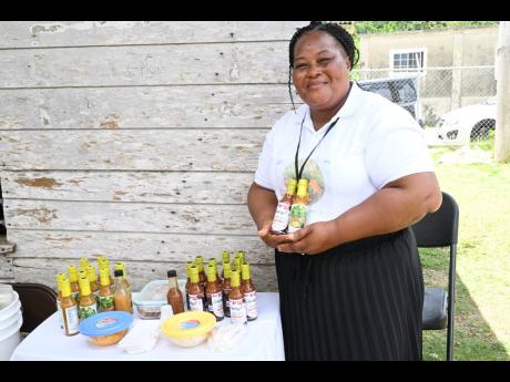 Farmer and entrepreneur of Whithorn in Westmoreland, Sheryl Kerr-Palmer, shows off her products, particularly Sheryl’s Homemade Pepper Sauce.