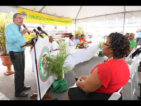 Minister of Science, Energy, Telecommunications and Transport, Daryl Vaz, addressing Wednesday’s launch of Road Safety Month 2025 at Chambers’ Texaco Service Station in Kingston.