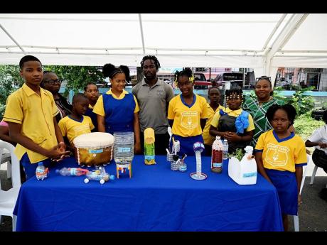 Students and staff of John’s Town Primary School proudly display their entries in the ‘Waste to Art’ competition on National Solid Waste Day, observed on June 6, at Rudolph Elder Park in Morant Bay, St Thomas.