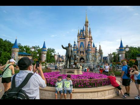 People visit the Magic Kingdom Park at Walt Disney World Resort in Lake Buena Vista, Florida, April 18, 2022.